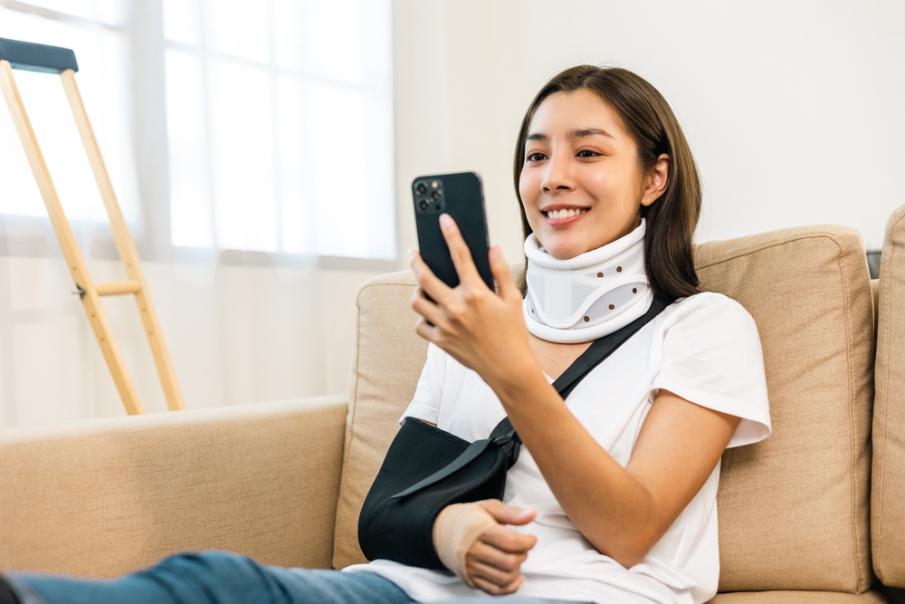 Happy injury claimant using OneSigniD to complete insurance application form online